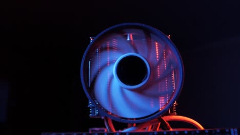 closeup-of-a-rotating-processor-CPU-fan-installed-on-the-motherboard-on-a-black-background