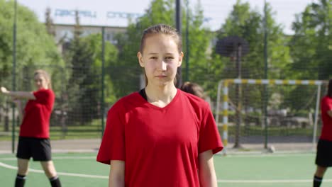 Portrait-of-Teen-Female-Soccer-Player-on-Outdoor-Field