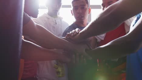 Coach-and-soccer-players-motivating-in-the-locker-room