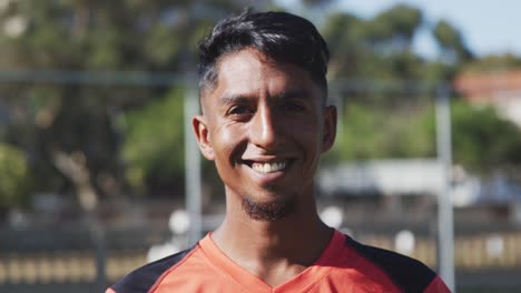 Soccer-player-smiling-at-camera-on-the-field