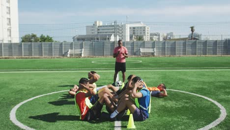 Soccer-players-training-on-field