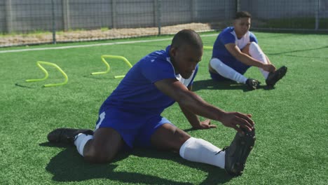 Soccer-players-stretching-on-field