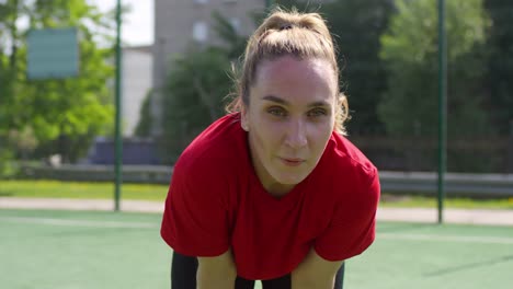 Female-Soccer-Player-Resting-after-Match