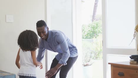 Africa-american-father-catching-his-daughter-and-hugging-her