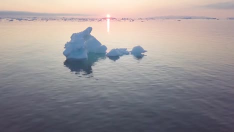 Icebergs-drone-aerial-video-top-view---Climate-Change-and-Global-Warming---Icebergs-from-melting-glacier-in-icefjord-in-Ilulissat,-Greenland.-Arctic-nature-ice-landscape-in-Unesco-World-Heritage-Site.