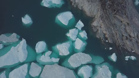 Icebergs-drone-aerial-video-top-view---Climate-Change-and-Global-Warming---Icebergs-from-melting-glacier-in-icefjord-in-Ilulissat,-Greenland.-Arctic-nature-ice-landscape-in-Unesco-World-Heritage-Site.