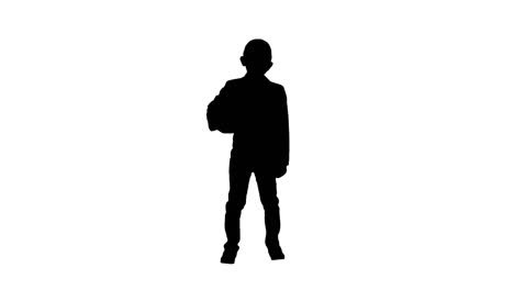 Silhouette-Happy-young-school-boy-holding-a-football