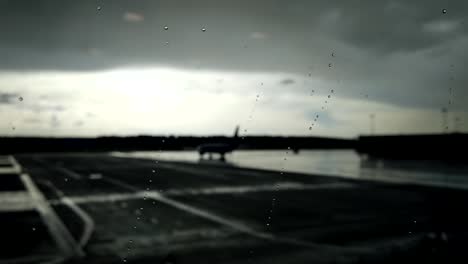 A-drop-of-water-glides-over-the-glass-at-the-airport