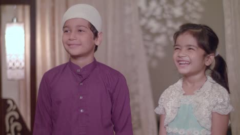 Muslim-Children-smiling,-happy-to-receive-Gifts-from-Parents-on-Eid-Holidays