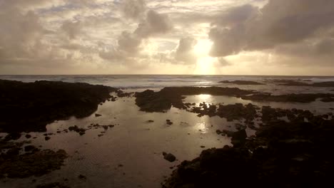 Aerial-close-up-view-of-water-waves-near-strand-in-Indian-Ocean,-Mauritius-Island