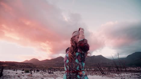 Boho-girl-walking-in-nature-on-a-summer-evening