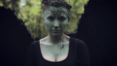 4k-Halloween-Dark-Angel-Woman-with-Black-Wings-Goes-into-Forest