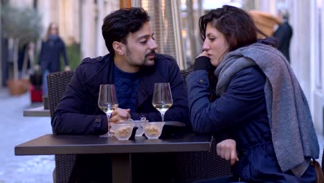 portrait-of-young-couple-arguing-during-happy-hour--outdoor