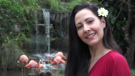 Adult-Female-at-Waterfall-with-Flamingos