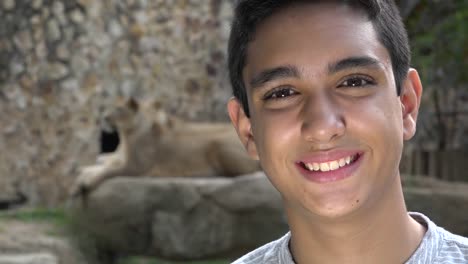 Teen-Boy-Posing-at-Lion-Exhibit