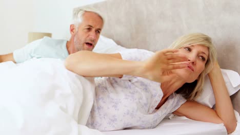 Couple-having-an-argument-in-bed