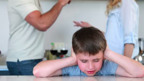 Little-boy-blocking-out-noise-from-parents-fighting