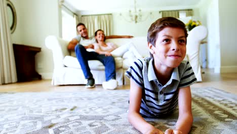 Parents-and-son-watching-television-in-living-room