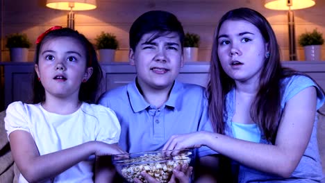 Children-watching-scary-movie-on-TV