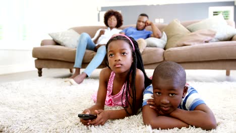 Children-watching-television-in-living-room