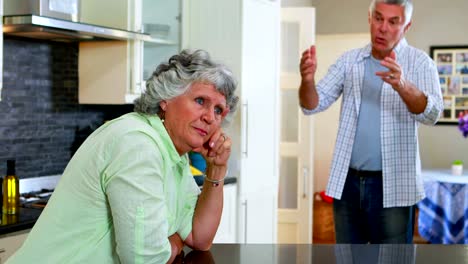 Frustrated-senior-man-shouting-on-woman-in-kitchen-4k