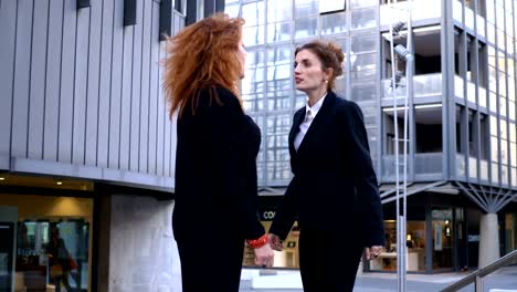 fight-between-two-young-business-woman--outdoor