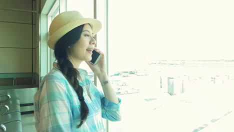 travel-Asian-woman-talking-on-smart-phone