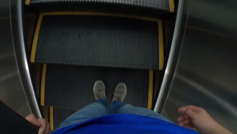 People-with-skateboard-moving-on-escalator