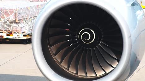 Airplane-turbo-engine-blades-fan-on-the-right-wing-and-test-moving-before-take-off-for-long-flight-to-Japan