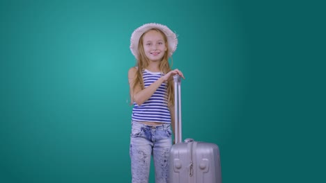 Traveling-girl-with-suitcase,-passport-and-ticket-isolated-on-green-background
