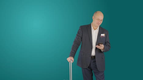 Business-man-with-suitcase-using-smartphone-while-waiting-in-departure-lounge