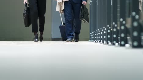 People-in-suits-going-in-terminal