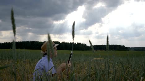 boy-enjoys-nature-view-and-uses-tablet,-artist,-dreamer