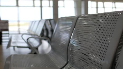 Nobody-on-waiting-chairs-zone-in-airport,-bus-station