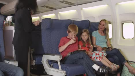 Mother-with-two-small-children-on-plane