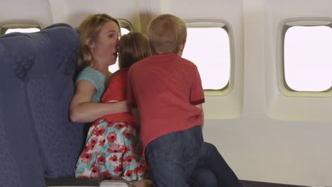 Mother-with-two-small-children-on-plane