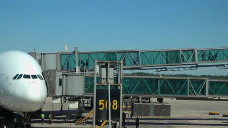 the-passengers-out-of-the-aircraft-through-a-glass-passage.