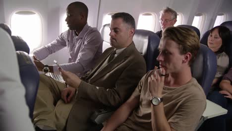 Flight-attendant-serving-drinks-and-snacks