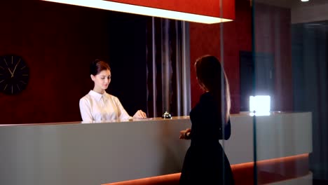 Hotel-service-manager-greeting-new-customer-businesswoman.-4K.