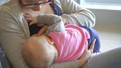 A-Woman-Breastfeeding-her-Child-at-the-Airport