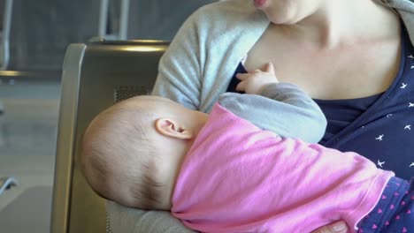 A-Woman-Breastfeeding-her-Child-at-the-Airport