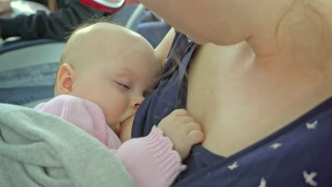 A-Woman-Breastfeeding-her-Child-on-a-Plane