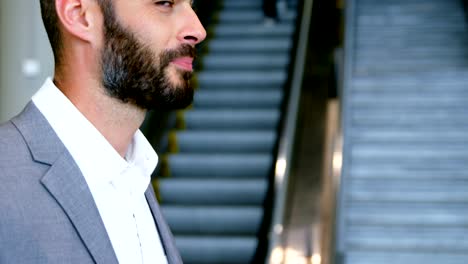 Businessman-having-coffee-from-disposable-cup