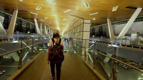 Girl-at-the-International-airport-in-Doha,-Qatar