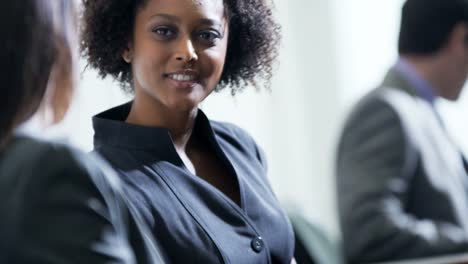 Ethnic-female-financial-advisor-meeting-colleague-in-airport