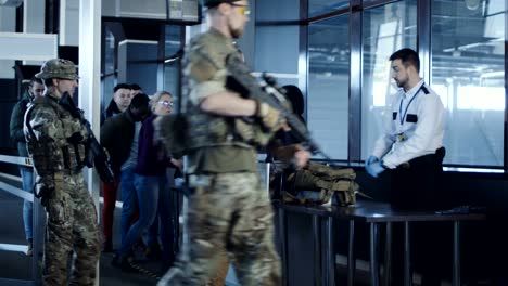 Man-transitting-weapon-standing-in-airport