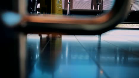 Close-up-of-businessman-with-luggage-waiting-to-board-on-airplane