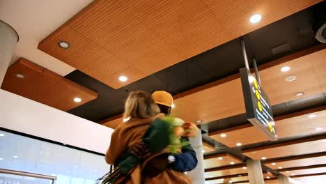 Young-happy-multi-ethnic-couple-meeting-at-airport-after-travel