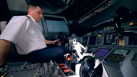 A-pilot-gets-ready-for-a-flight,-setting-up-plane's-equipment.-4K.