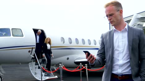 Businessman-using-mobile-phone-at-terminal-4k